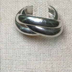 Three intertwined silver bands